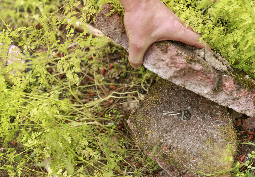 key hidden under rock outdoors